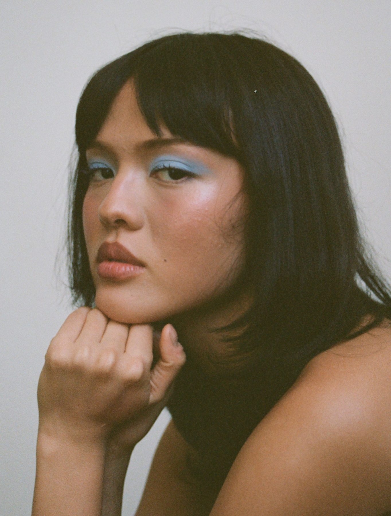 Sydney Taeko, makeup artist, 35mm film portrait with blue eyeshadow beauty makeup